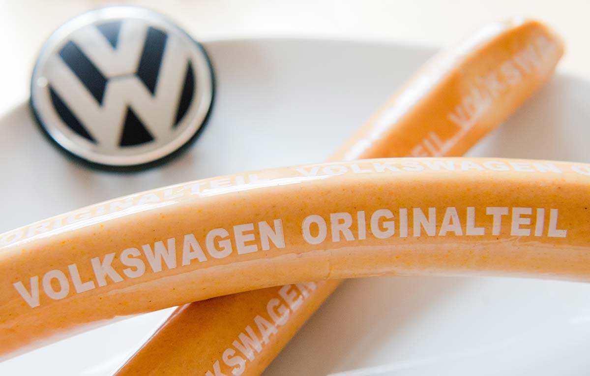 ILLUSTRATION - Curry sausages with 'Volkswagen Originalteil' (lit. 'original part') written on them lying on a kitchen table in Hanover, Germany, 19 February 2016. The curry sausage production at Volkswagen again excelled the car production in 2015. 7.2 million curry sausages were produced at Volkswagen's butcher shop in Wolfsburg in the past year. Photo by: Julian Stratenschulte/picture-alliance/dpa/AP Images