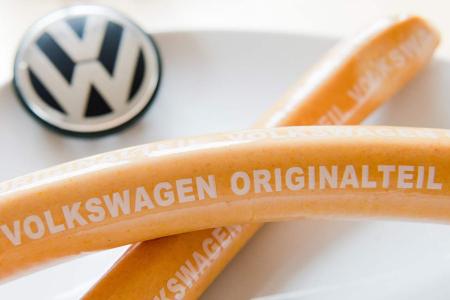 ILLUSTRATION - Curry sausages with 'Volkswagen Originalteil' (lit. 'original part') written on them lying on a kitchen table in Hanover, Germany, 19 February 2016. The curry sausage production at Volkswagen again excelled the car production in 2015. 7.2 million curry sausages were produced at Volkswagen's butcher shop in Wolfsburg in the past year. Photo by: Julian Stratenschulte/picture-alliance/dpa/AP Images