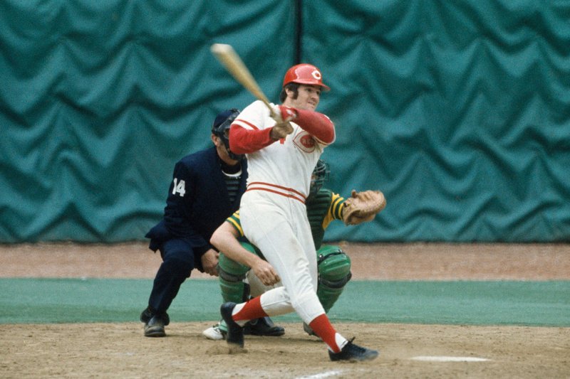 CINCINNATI - OCTOBER 1972: Pete Rose #14 of the Cincinnati Reds swings hard against the Oakland Athletics during the World Series at the Riverfront Stadium on October 1972 in Cincinnati, Ohio. (Photo by Focus on Sport/Getty Images)