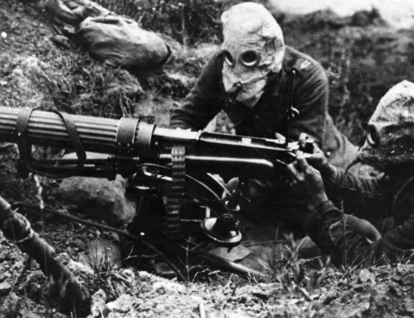 Gas-masked men of the British Machine Gun Corps with a Vickers machine gun during the first battle of the Somme. (General Photographic Agency/Getty Images)