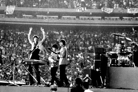 The Beatles perform at Shea Stadium, New York on 15th August 1965. (Photo by Michael Ochs Archives/Getty Images)