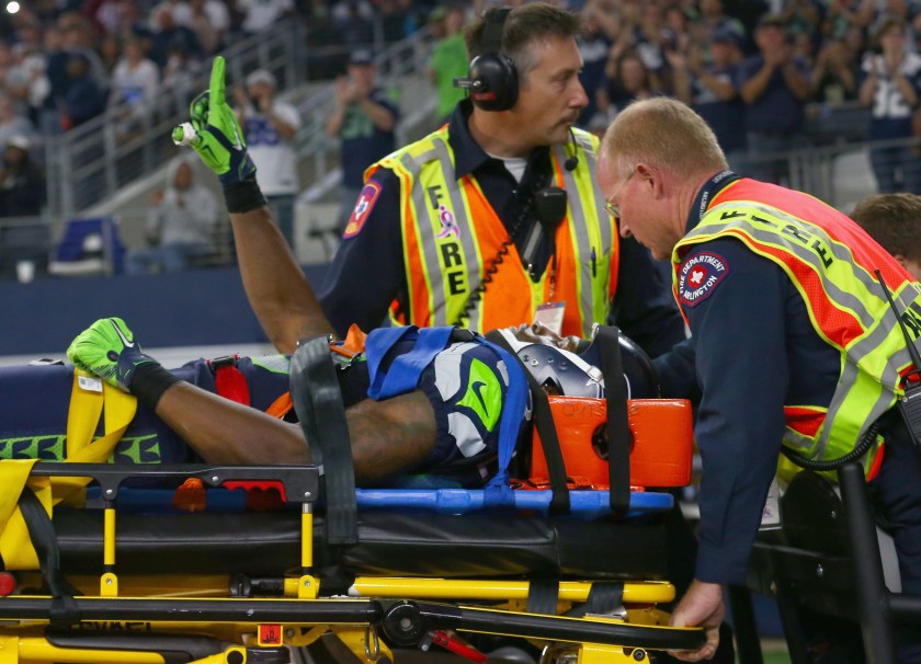 Ricardo Lockette #83 of the Seattle Seahawks waves to fans while being carted off the field in the second quarter at AT&T Stadium on November 1, 2015 in Arlington, Texas. (Photo by Tom Pennington/Getty Images)