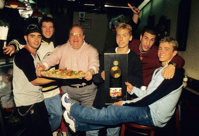 MIAMI - JUNE 06: Lou Pearlman pose with N'Sync Joey Fatone, Chris Kirkpatrick, JC Chasez, Lance Bass and Justin Timberlake seen at the N.Y.P.D. Pizza in Miami, circa 1996. (Photo by Mark Weiss/WireImage)