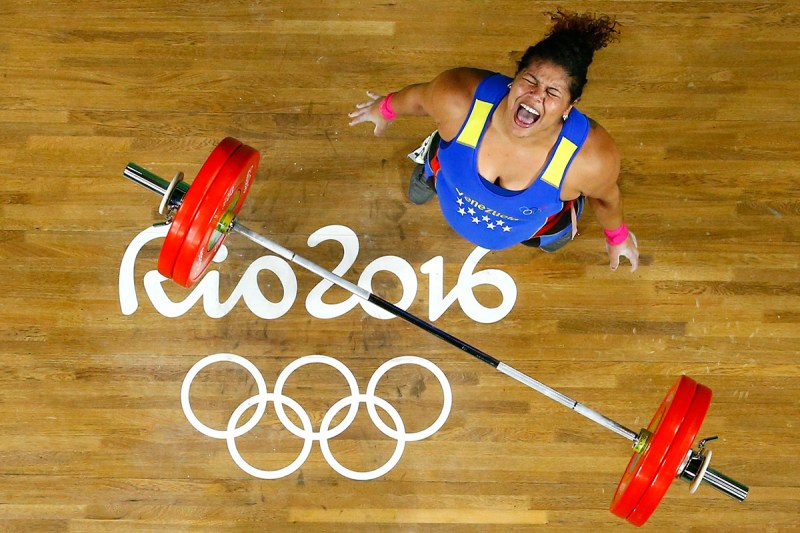 TOPSHOT - Venezuela's Yaniuska Isabel Espinosa reacts while competing during the Women's weightlifting +75kg event at the Rio 2016 Olympic Games in Rio de Janeiro on August 14, 2016 / AFP / POOL / STR (Photo credit should read STR/AFP/Getty Images)