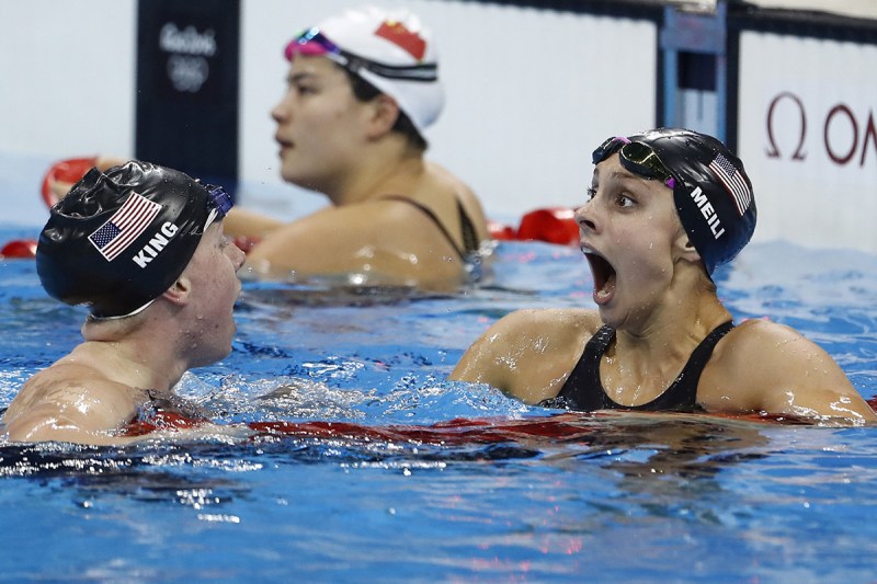 USA's Lilly King (L) celebrates with USA's Katie Meili after she broke the Olympic record to win the Women's 100m Breaststroke Final. (Odd Andersen/AFP/Getty Images)