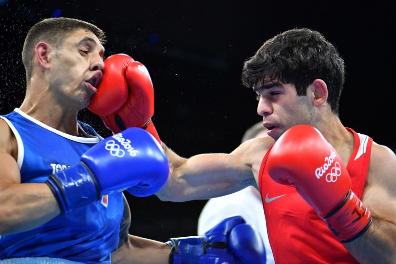 TOPSHOT - Armenia's Artur Hovhannisyan (R) lands a punch on Spain's Samuel Carmona Heredia during the Men's Light Fly (46-49kg) match at the Rio 2016 Olympic Games at the Riocentro - Pavilion 6 in Rio de Janeiro on August 6, 2016. / AFP / Yuri CORTEZ (Photo credit should read YURI CORTEZ/AFP/Getty Images)