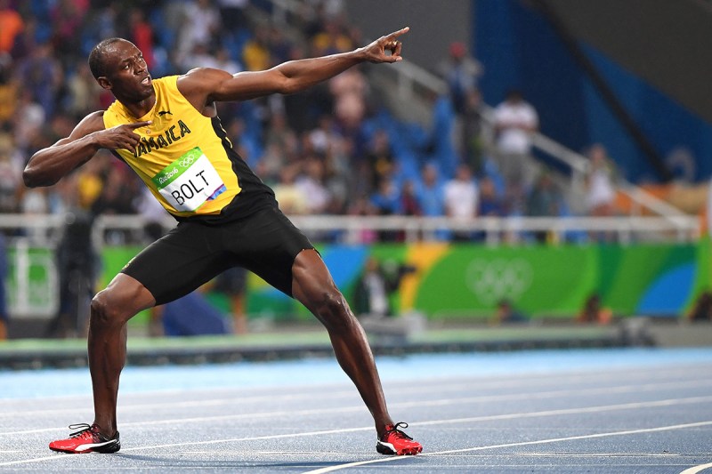 TOPSHOT - Jamaica's Usain Bolt does his "Lightening Bolt"pose after he won the Men's 200m Final during the athletics event at the Rio 2016 Olympic Games at the Olympic Stadium in Rio de Janeiro on August 18, 2016. / AFP / OLIVIER MORIN (Photo credit should read OLIVIER MORIN/AFP/Getty Images)