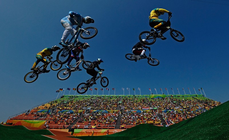 TOPSHOT - Riders compete in the BMX cycling men's quarterfinals event at the X-Park BMX venue in Deodoro during the Rio 2016 Olympic Games in Rio de Janeiro on August 18, 2016. / AFP / CARL DE SOUZA (Photo credit should read CARL DE SOUZA/AFP/Getty Images)