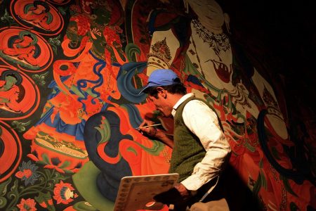 In this photograph taken on June 15, 2016, a Nepalese artist restores sacred murals in a monastry in Lo Manthang in Upper Mustang.
Deep in the heart of a medieval monastery in Nepal's remote Upper Mustang region, the battle to restore sacred murals and preserve traditional Tibetan Buddhist culture is in full swing. / AFP / PRAKASH MATHEMA / To go with 'Nepal-Tibet-Buddhism-Architecture-Painting' FEATURE by Ammu Kannampilly        (Photo credit should read PRAKASH MATHEMA/AFP/Getty Images)