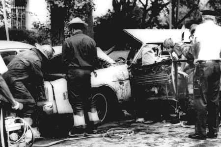 Firemen remove victims from a car shattered by a bomb blast on Embassy Row in Washington, D.C. Sept. 21, 1976. Orlando Letelier, former Chilean ambassador to the U.S., and Ronne Karpen Moffitt, his aide, were both killed in the blast.  (AP Photo)