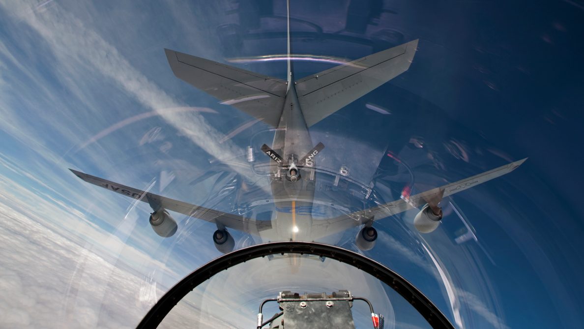 An F-16 flies in the pre-contact position behind a KC-135R from the Arizona Air National Guard. (HIGH-G Productions/Stocktrek Images)