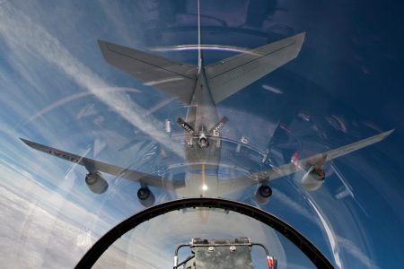 An F-16 flies in the pre-contact position behind a KC-135R from the Arizona Air National Guard. (HIGH-G Productions/Stocktrek Images)