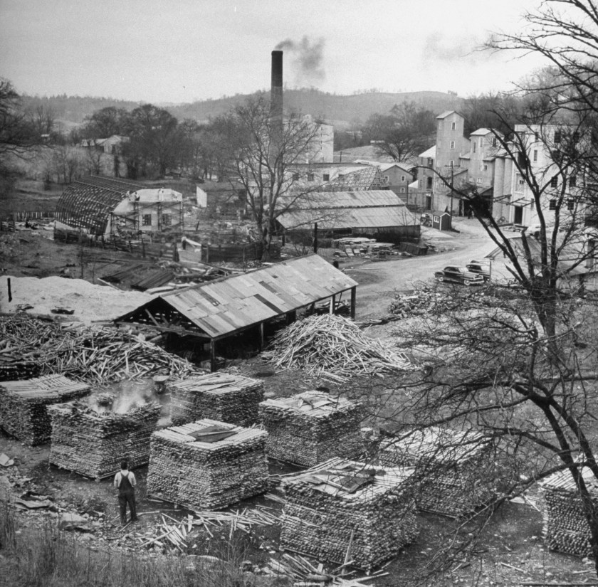 Making Jack Daniels whiskey at his distillery, showing the leaching process with charcoal. (Photo by Ed Clark/The LIFE Picture Collection/Getty Images)