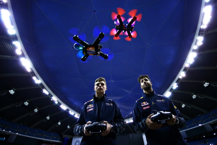 Daniel Ricciardo of Australia and Red Bull Racing and Max Verstappen of Netherlands and Red Bull Racing race drones on June 8, 2016 in Montreal, Canada. (Dan Istitene/Getty Images)