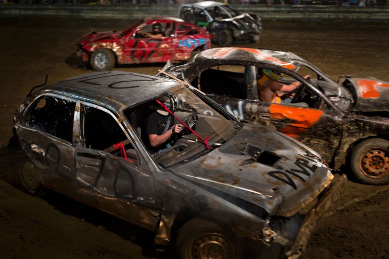 Drivers compete in the annual demolition derby at the Cambria County Fair on September 8, 2016, in Ebensburg, Pennsylvania. In the tiny Pennsylvania town of Ebensburg, deep in the heart of America's Rust Belt, 80 cars signed up for the demolition derby at the Cambria County Fair. By the end, there were only two winners -- and 80 wrecks. / AFP / DOMINICK REUTER (Photo credit should read DOMINICK REUTER/AFP/Getty Images)