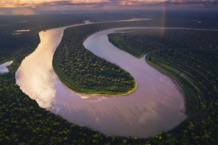 Aerial view of Madre de Dios River winding through Amazonian rain forest. (Theo Allofs/ Corbis Documentary)