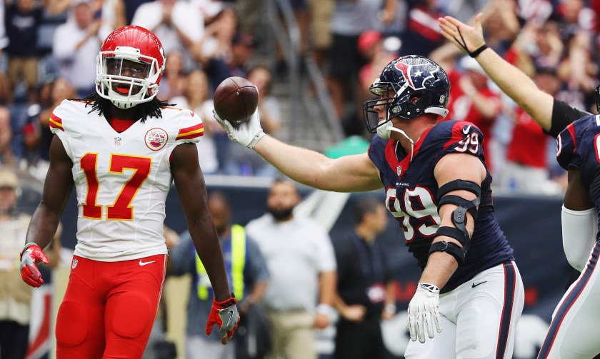 J.J. Watt #99 of the Houston Texans celebrates a fumble recovery as Chris Conley #17 of the Kansas City Chiefs looks on in the first quarter of their game at NRG Stadium on September 18, 2016 in Houston, Texas. (Scott Halleran/Getty Images)