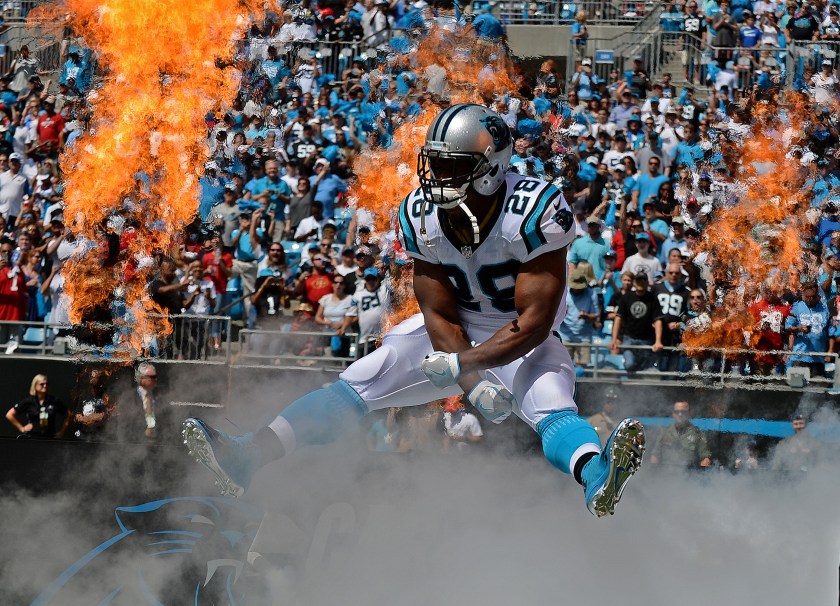 Carolina Panthers running back Jonathan Stewart leaps into the air as he is introduced prior to first quarter action against the San Francisco 49ers on Sunday, Sept. 18, 2016 at Bank of America Stadium in Charlotte, N.C. (Jeff Siner/Charlotte Observer/TNS via Getty Images)