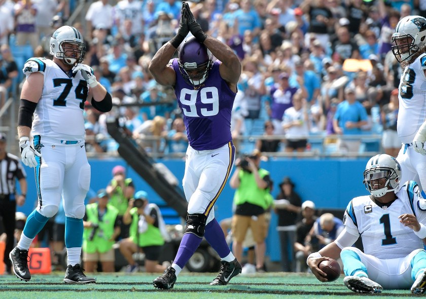 Danielle Hunter #99 of the Minnesota Vikings reacts after sacking Cam Newton #1 of the Carolina Panthers for a safety during the game at Bank of America Stadium on September 25, 2016 in Charlotte, North Carolina. (Grant Halverson/Getty Images)