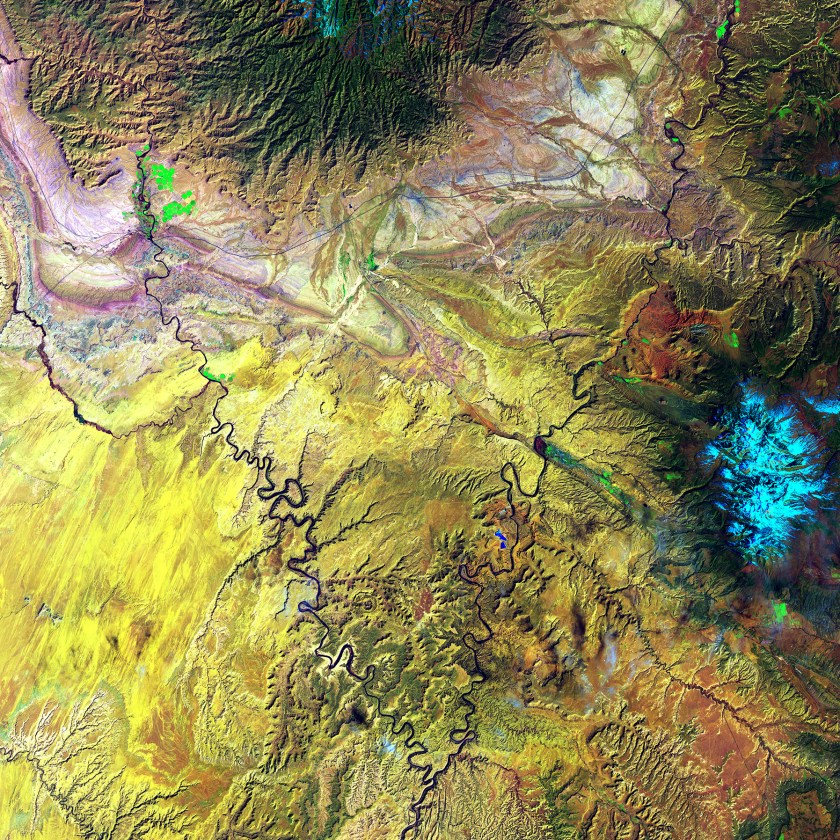 The Green River and the Colorado River meet within Canyonlands National Park in Utah. Snow-covered Mount Waas, shown in light blue on the right side of the image, overlooks the arches, canyons, and bizarre rock formations that prevail throughout this region. (USGS/NASA)