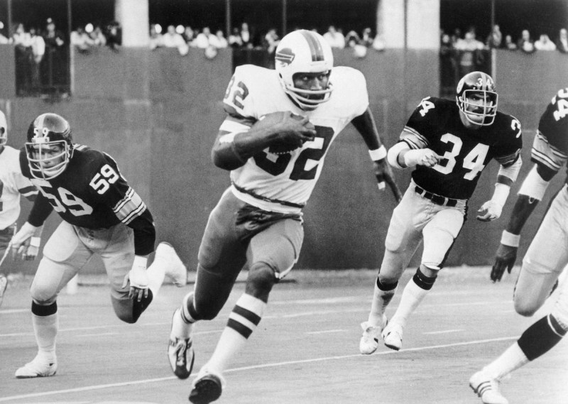 O.J. Simpson breaks away from Steeler tacklers Jack Russell (59) and Andy Russell (34) to run 87-yards for a touchdown in the third quarter of the game.