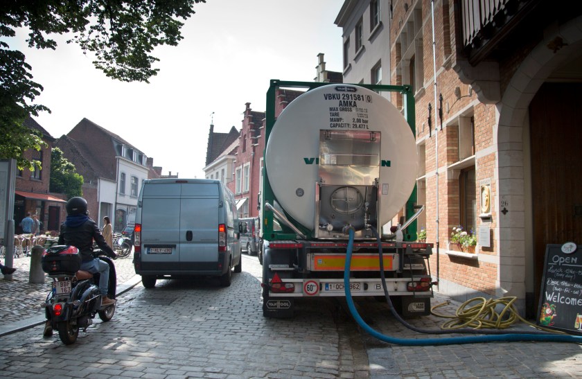 A truck pumping beer is parked outside at the Halve Maan Brewery in Bruges, Belgium on Thursday, May 26, 2016. The use of trucks will soon be a thing of the past as the brewery has recently created a beer pipeline which will ship beer straight from the brewery to the bottling plant, two kilometers away, through underground pipes running between the two sources. (AP Photo/Virginia Mayo)