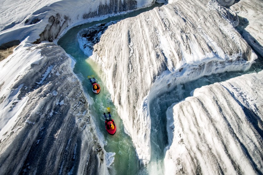 Seen carving their way through the icy rivers of the Aletsch Glacier in Switzerland, Swiss mountain guide, Claude-Alain Gailland and canyon activity specialist, Gilles Janin, are part of only a handful people in the world qualified enough to perform the treacherous run. Located on a UNESCO world heritage site, mountaineering photographer, David Carlier, 42, spent five hours trudging through the icy terrain to reach the summit of the colossal ice mass. (David Carlier/Caters News)