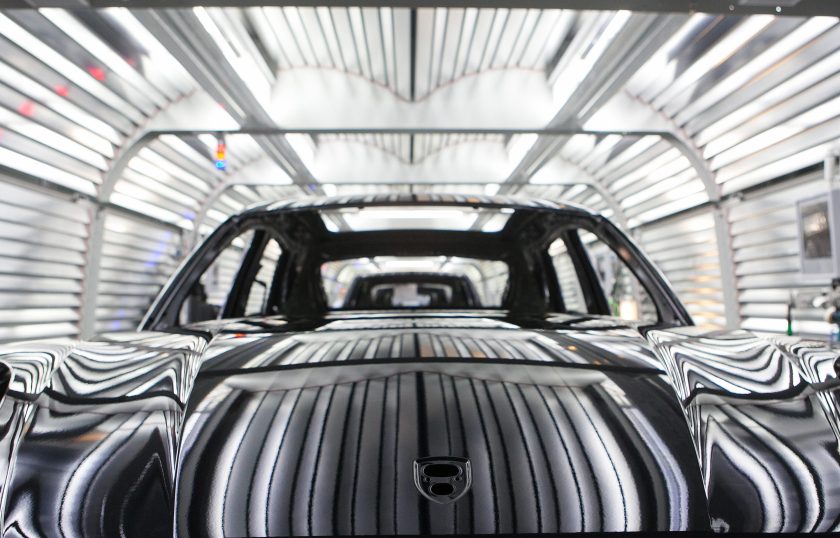 Painted chassis of Porsche Macan sport-utility vehicles (SUV) pass through the paint shop inside the newly expanded Porsche AG factory in Leipzig, Germany, on Wednesday, Feb. 5, 2014. Porsche AG Chief Executive Officer Matthias Mueller said the high-end automaker will exceed 200,000 in annual deliveries in 2015, three years earlier than first targeted, on demand for the Macan compact sport-utility vehicle going on sale later this year. (Krisztian Bocsi/Bloomberg via Getty Images)