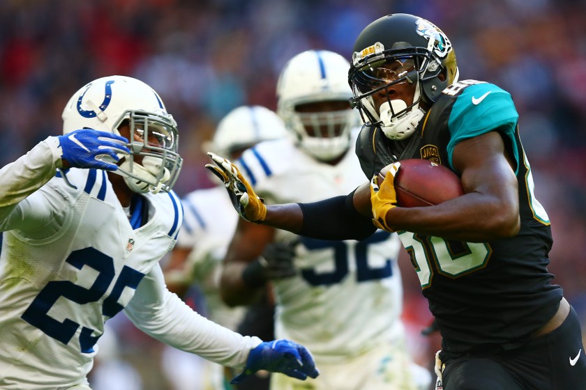  Allen Hurns #88 of the Jacksonville Jaguars hands off Patrick Robinson #25 of the Indianapolis Colts to score a touchdown during the NFL game between Indianapolis Colts and Jacksonville Jaguars at Wembley Stadium on October 2, 2016 in London, England. (Photo by Dan Istitene/Getty Images)