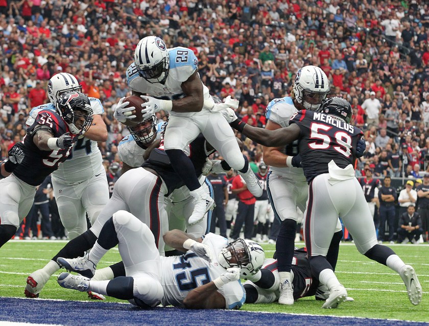 DeMarco Murray #29 of the Tennessee Titans leaps over the Houston Texans defensive line for a touchdown in the second quarter during the NFL game between the Tennessee Titans and the Houston Texans at NRG Stadium on October 2, 2016 in Houston, Texas. (Thomas B. Shea/Getty Images)