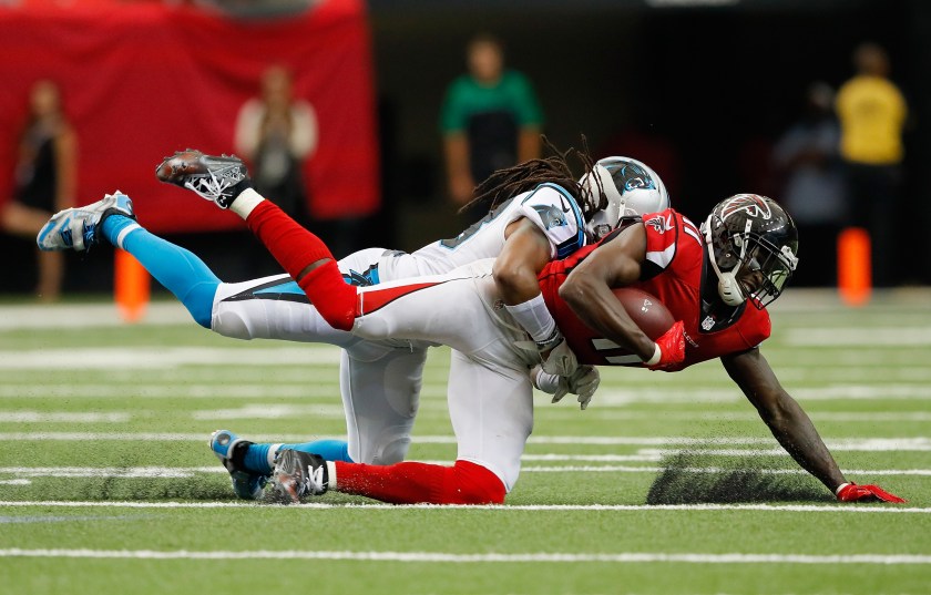 Julio Jones #11 of the Atlanta Falcons dives for more yardage as he is tackled by Tre Boston #33 of the Carolina Panthers at Georgia Dome on October 2, 2016 in Atlanta, Georgia. (Kevin C. Cox/Getty Images)