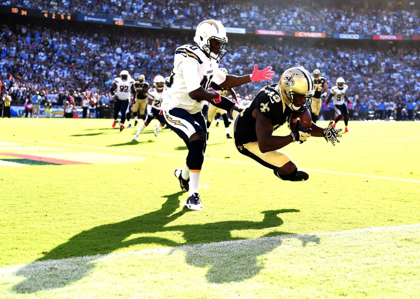 Michael Thomas #13 of the New Orleans Saints makes a catch for a touchdown in front of Pierre Desir #40 of the San Diego Chargers to trail 28-34 during the fourth quarter at Qualcomm Stadium on October 2, 2016 in San Diego, California. The Saints came back to win 35-34. (Photo by Harry How/Getty Images)