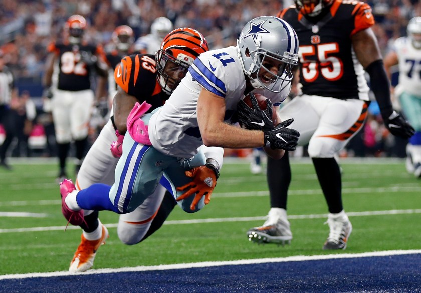 Cole Beasley #11 of the Dallas Cowboys dives into the end zone to score a touchdown after catching a pass from quarterback Dak Prescott #4 during the second quarter against the Cincinnati Bengals at AT&T Stadium on October 9, 2016 in Arlington, Texas. (Wesley Hitt/Getty Images)