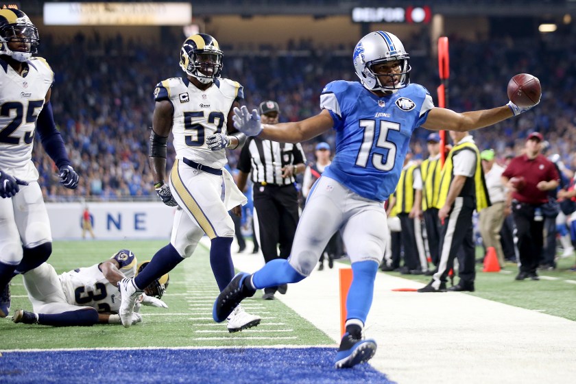 Golden Tate #15 of the Detroit Lions holds out the football after scoring a touchdown during fourth quarter action against the Los Angeles Rams at Ford Field on October 16, 2016 in Detroit, Michigan. The Detroit Lions defeated the Los Angeles Rams 31-28. (Leon Halip/Getty Images)