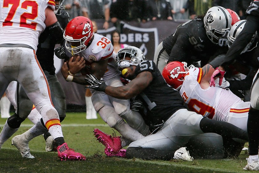 Spencer Ware #32 of the Kansas City Chiefs scores on a two-yard rush against the Oakland Raiders during their NFL game at Oakland-Alameda County Coliseum on October 16, 2016 in Oakland, California. (Brian Bahr/Getty Images)