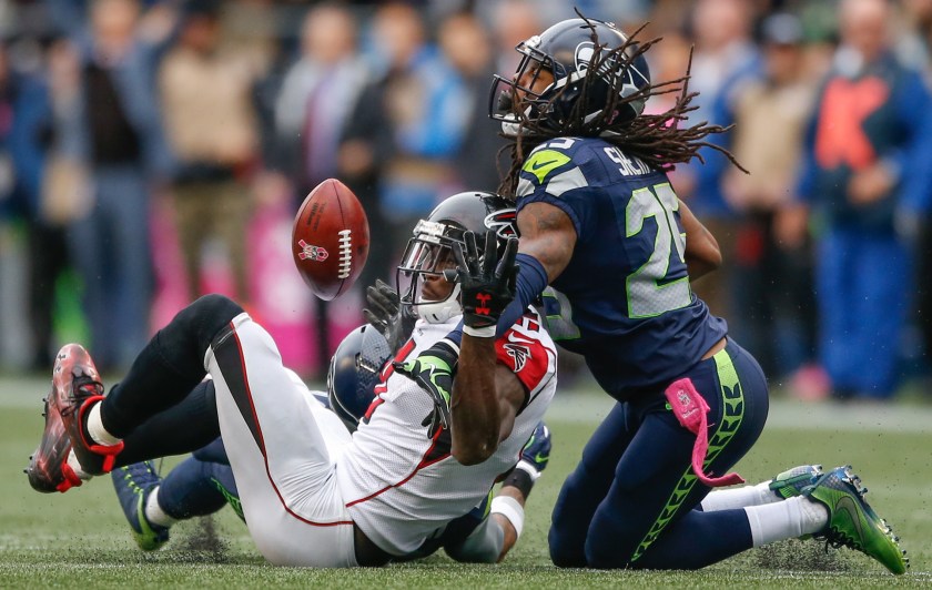 Wide receiver Julio Jones #11 of the Atlanta Falcons can't make the catch on fourth down as cornerback Richard Sherman #25 of the Seattle Seahawks defends at CenturyLink Field on October 16, 2016 in Seattle, Washington. (Otto Greule Jr/Getty Images)