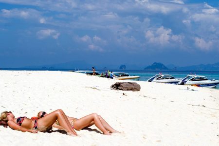 Sunbathers relax on the beach of a paradise island part of Ko Phi Phi islands in the Adaman Sea, Krabi province, Thailand. (Lucas Schifres/Getty Images)