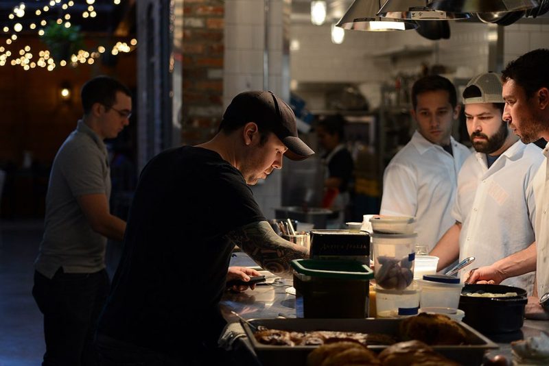 WASHINGTON, D.C., DECEMBER 3, 2013: Chef Aaron Silverman, second from left, and his team prepare dishes inside the open kitchen at Rose's Luxury on Capitol Hill. (Photo by Astrid Riecken for The Washington Post via Getty Images)