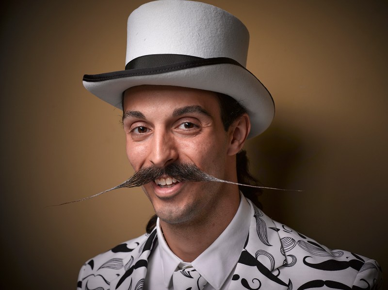 PIC BY GREG ANDERSON / CATERS NEWS - (PICTURED: A contestant of the beard championship with a long moustache.) - Gents from around the world descended on Nashville earlier this month fighting for the title of best beard in the National Beard and Moustache Championship. The annual competition covers 17 categories in which the men can compete, ranging from freestyle, to natural, to facial hair inspired by icons such as Dali and the Musketeers. With the competition as stiff as the waxed moustaches, competitors had to go beard to beard to decide whose facial fuzz was the most fan-TASH-tic. Competitors were judged on their overall appearance, style and personality, with judges also considering originality and creativity in the freestyle categories. Contestants certainly rose to the challenge with perfectly curled beards and also more outrageous statement styles, such as a Tim Burton themed beard, and a beard styled to look like a beak. - SEE CATERS COPY