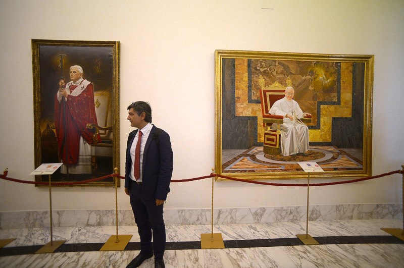 A tourist visits the Pontiffs gallery at the pope's summer residence of Castel Gandolfo on September 11, 2015. Pope Francis has recently decided to open a steam train link from the Vatican's train station to Castel Gandolfo for visitors as well as part of his summer residence. AFP PHOTO / FILIPPO MONTEFORTE = RESTRICTED TO EDITORIAL USE, MANDATORY MENTION OF THE ARTIST UPON PUBLICATION, TO ILLUSTRATE THE EVENT AS SPECIFIED IN THE CAPTION = (Photo credit should read FILIPPO MONTEFORTE/AFP/Getty Images)