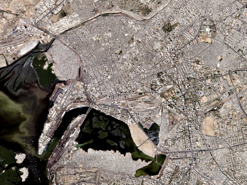 Photographed on October 10, 2016, the Karachi International Container Terminal (left) is the entrance to the largest city in Pakistan and the 7th largest city in the world. Also known as the City of The Quaid for being the birthplace and final resting place (top right) of Quaid-e-Azam Muhammad Ali Jinnah (the founder of Pakistan). (Courtesy Planet Labs)