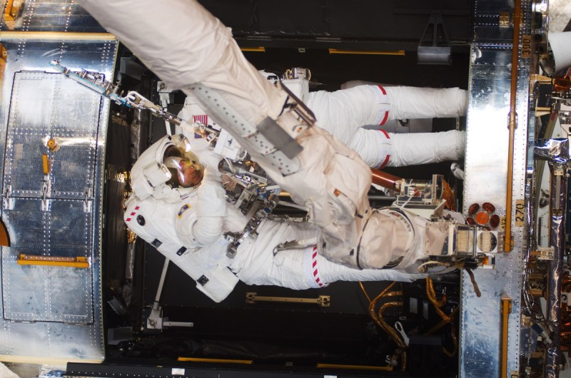 Astronauts Michael Good (bottom) and Mike Massimino, both STS-125 mission specialists, participate in the mission's fourth session of extravehicular activity (EVA) as work continues to refurbish and upgrade the Hubble Space Telescope (NASA via Getty Images)