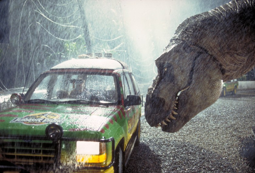 A Tyrannosaurus Rex menaces the theme park's first customers in a scene from the film 'Jurassic Park', 1993. (Photo by Murray Close/Getty Images)