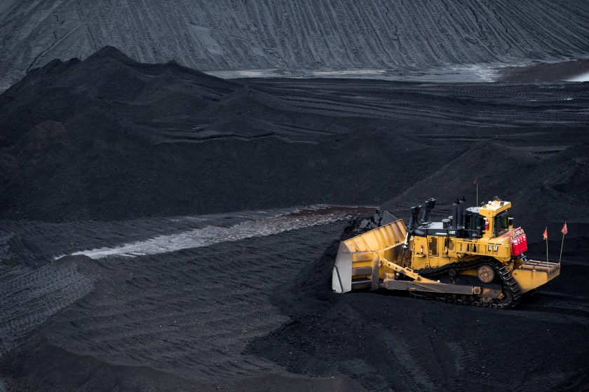 A bulldozer smoothes a coal pile in the storage yard at Consol Energy Inc.'s CNX Marine Terminals Inc. coal transshipment marine terminal in Baltimore, Maryland, U.S., on Tuesday, Sept. 22, 2015. (Andrew Harrer/Bloomberg via Getty Images)