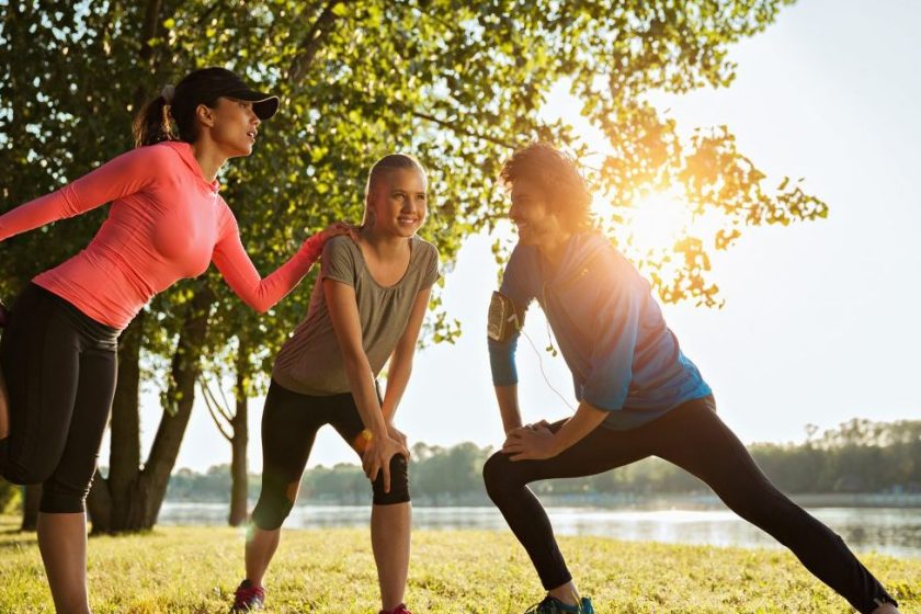 Close up of a friends stretching after a run (Getty Images)