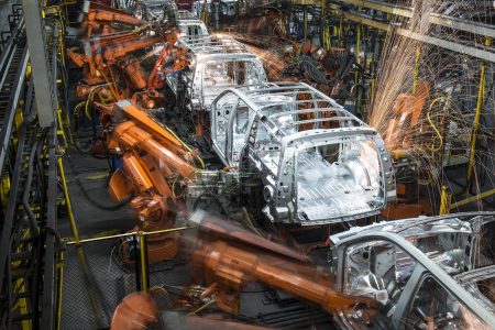 Robotic machines weld together the frames of sports utility vehicles (SUV) during production at the General Motors Co. (GM) assembly plant in Arlington, Texas, U.S., on Thursday, March 10, 2016. (Matthew Busch/Bloomberg via Getty Images)