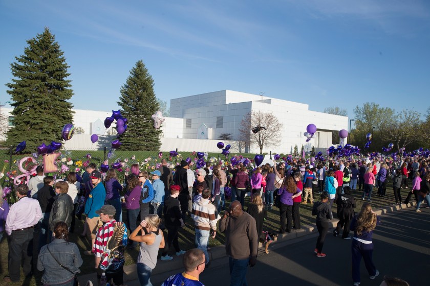 Music fans visit a memorial outside Paisley Park, the home and studio of Prince, on April 22, 2016 in Chanhassen, Minnesota. Prince, 57, was pronounced dead shortly after being found unresponsive at Paisley Park. (Scott Olson/Getty Images)