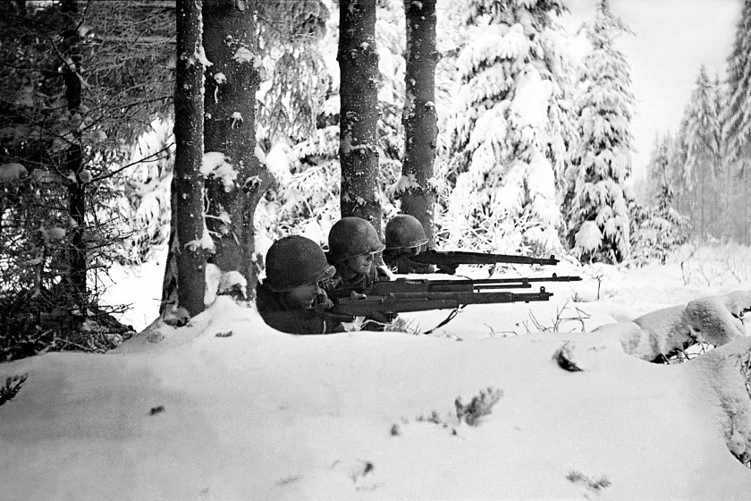 Three US infantrymen in the snow during the Battle of the Bulge, Ardennes, Belgium, World War II, January 1945. (Tony Vaccaro/Getty Images)