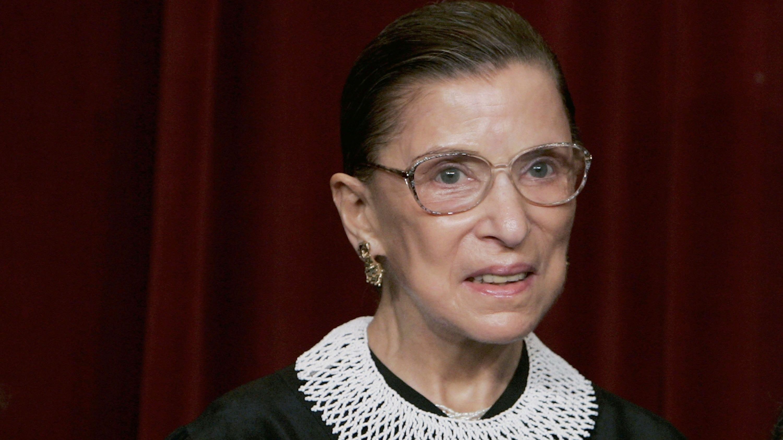 U.S. Supreme Court Justice Ruth Bader Ginsburg smiles during a photo session with photographers at the U.S. Supreme Court March 3, 2006 in Washington DC.  (Photo by Mark Wilson/Getty Images)