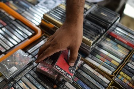 This picture taken on October 8, 2016 shows a collector browsing audio cassettes during "International Cassette Store Day" in Subang Jaya, on the outskirts of Kuala Lumpur. (Mohd Rasfan/AFP/Getty Images)